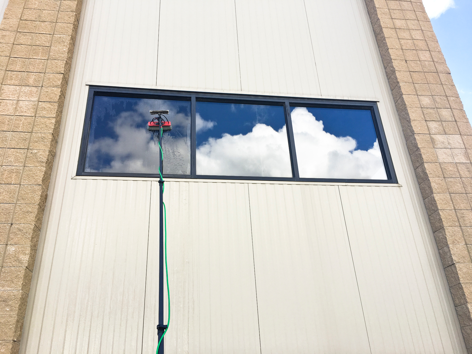 Waterfed pole cleaning a home window